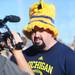 Michigan fan Jerry "Big JP" Parker, of Atlanta does an interview with a television crew during a Michigan pep rally at the Allstate Fan Fest in New Orleans, LA, on Monday.  Melanie Maxwell I AnnArbor.com